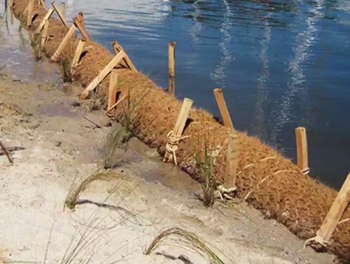 erosion control coir logs on shore