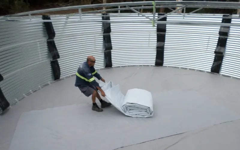 399-0520-tank-liner-gray-man-unrolling-800x800-032026