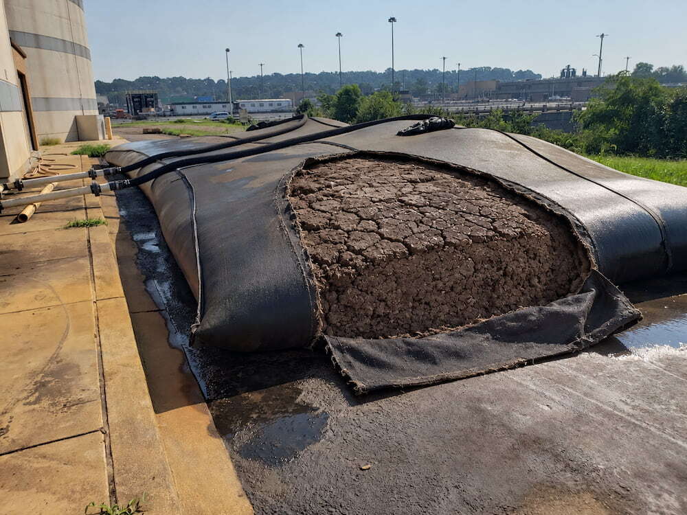 Cutaway geotextile bag reveals sludge cake