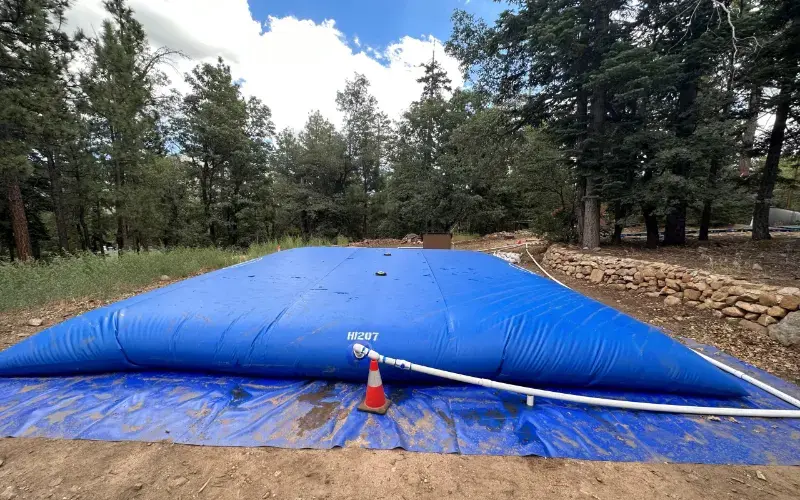 309-0518-blue-water-bladder-tank-800x500-022026